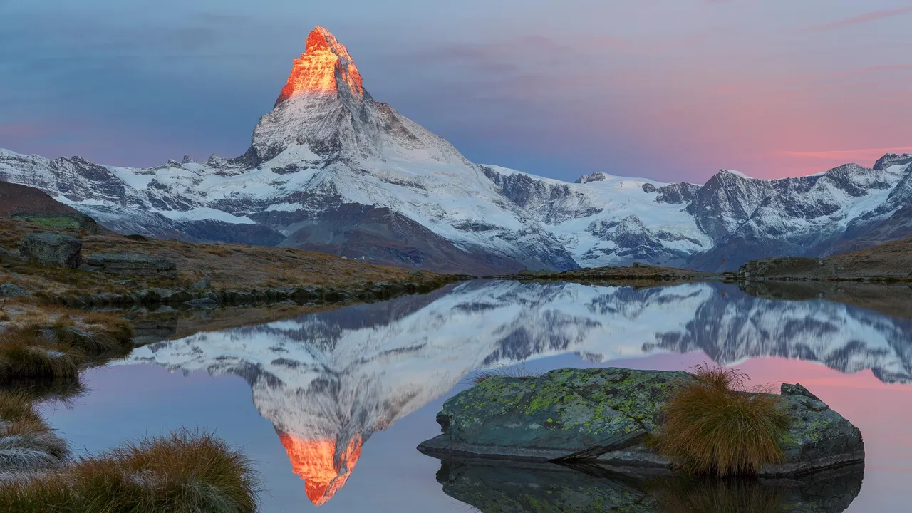 The Matterhorn reflected in Lake Stellisee at sunrise, Zermatt, Switzerland