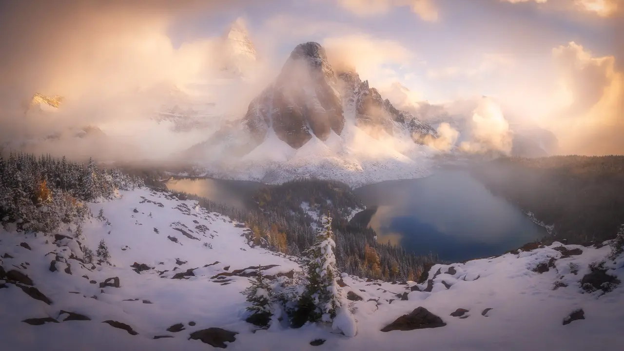 A peak peeks through the clouds